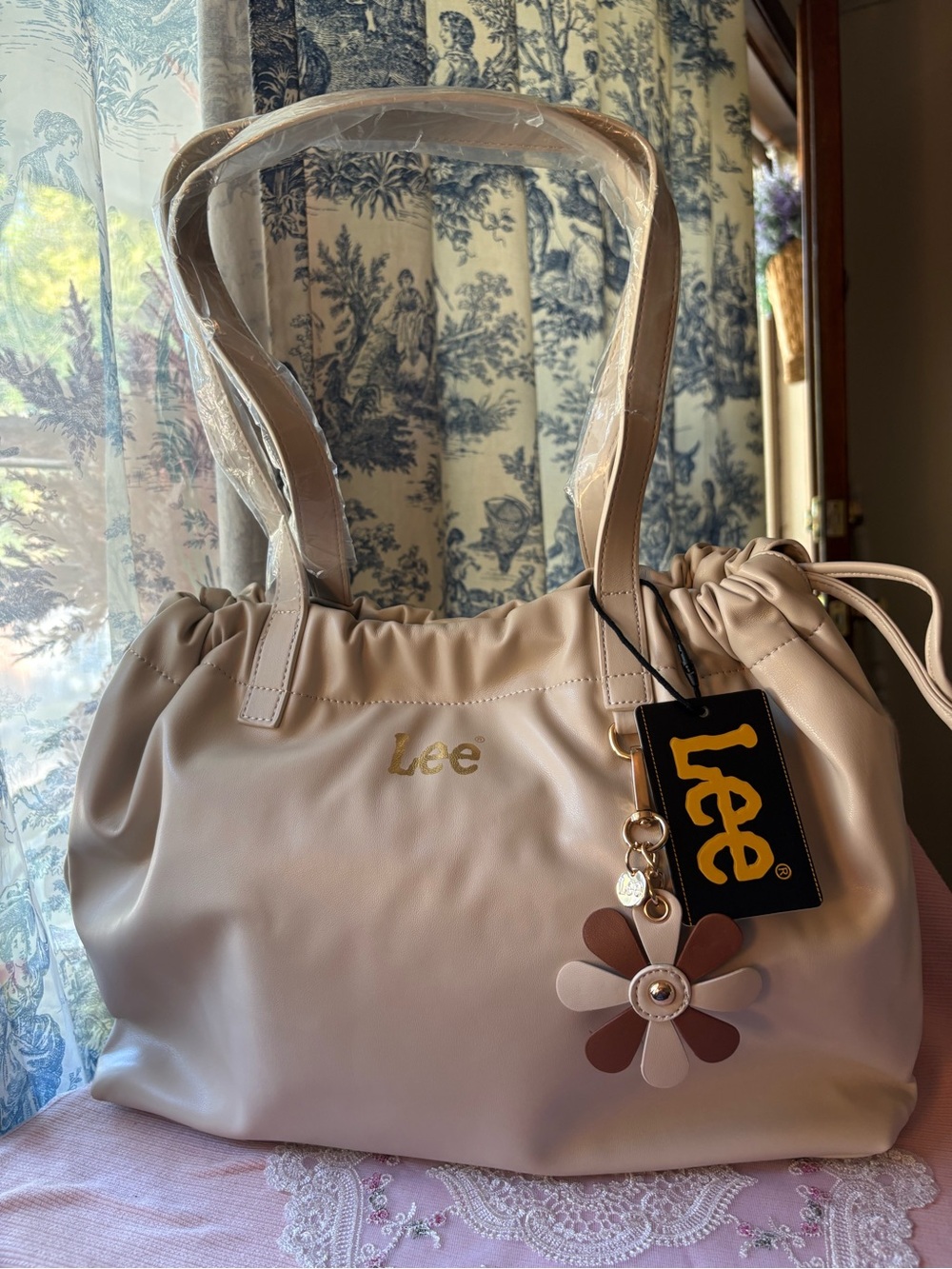 Lee Cream Shoulder Bag with Floral Charm Accent
